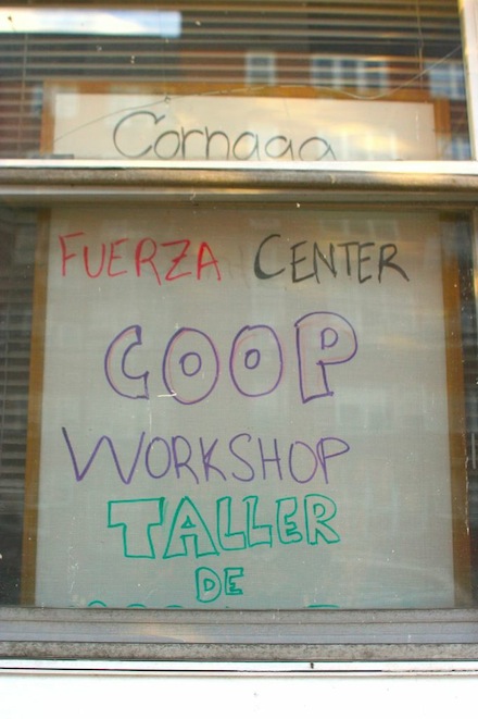 A handmade sign advertises the cooperative workshops in the window of Church of the Prophecy. (Peter Rugh / WNV)