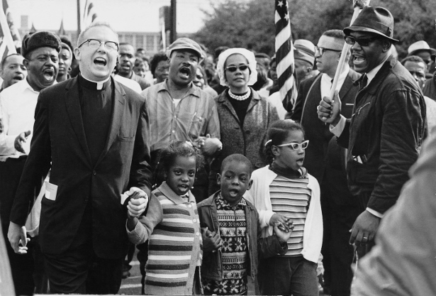 Martin Luther King and Ralph Abernathy and their wives, Coretta and Juanita, lead a march from Selma to Montgomery in 1965, with the Abernathy children on the front line. (Wikimedia Commons/Abernathy Family)