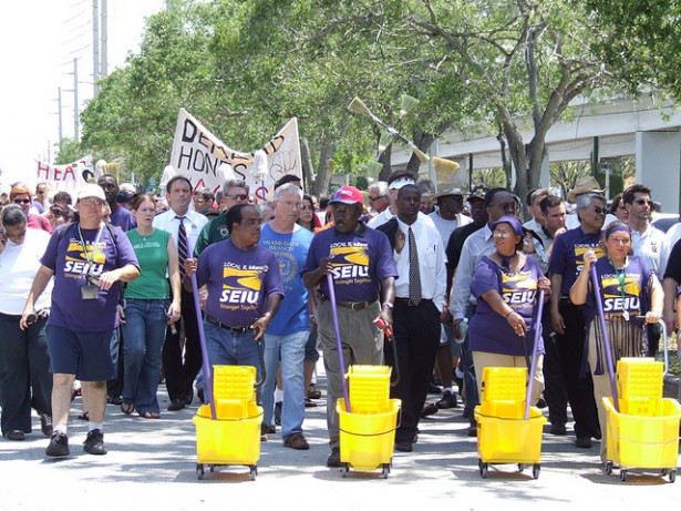 A protest of janitors with their mops and buckets in Miami in 2006. ( Flickr/SEIU)