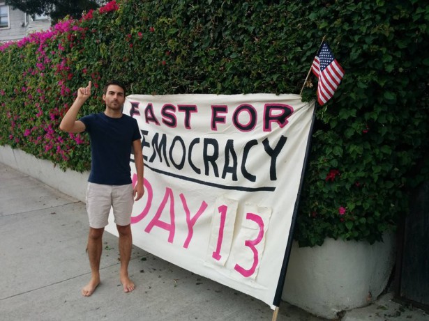 Kai Newkirk calls out the 1% and seeks to engage people in the pro-Democracy movement - Photo via Wagingnonviolence.org