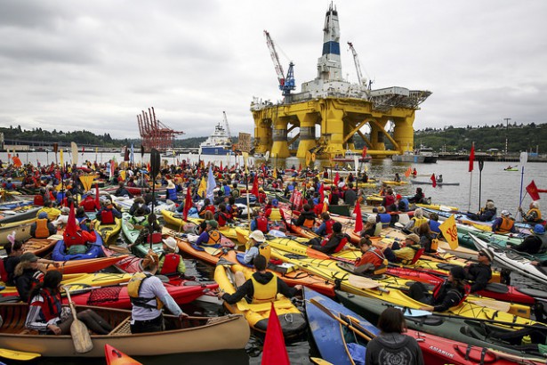 Kayak-tivists gathered in Elliott Bay on Saturday, May 16, where the Polar Pioneer drilling rig is docked. (Flickr / Backbone Campaign)