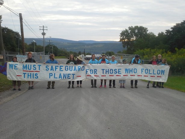Students from five colleges helped hold the banner blocking Crestwood's gates. (Facebook / We Are Seneca Lake)