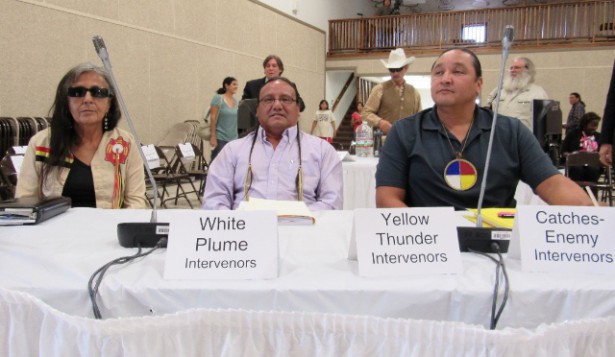 Debra White Plume (with Lakota cultural experts) prepares to testify at the Nuclear Regulatory Commissions' hearings.