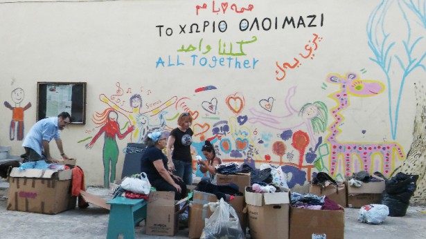Volunteers at Pikpa pack goods for refugees. (WNV / Tom Leonard)