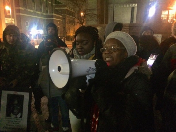 Akai Gurley's aunt speaks to a crowd outside the NYPD's headquarters on Friday after the conviction of officer Peter Liang. (WNV / Ashoka Jegroo)