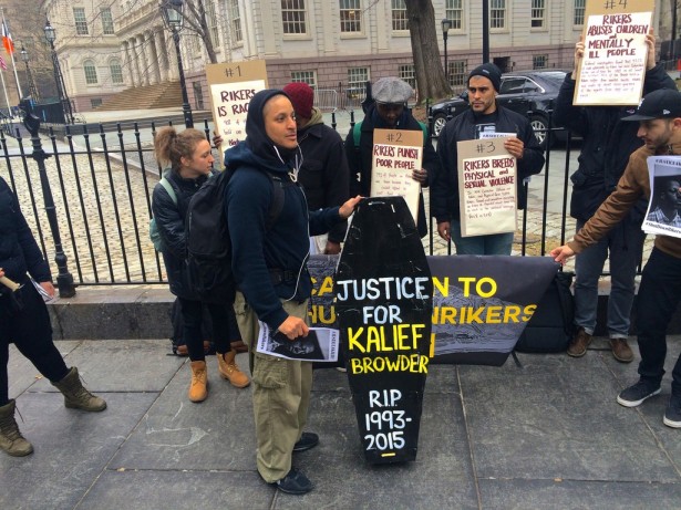An activists holds a mock coffin for Kalief Browder outside City Hall in New York City on Feb. 23. (WNV/Ashoka Jegroo)