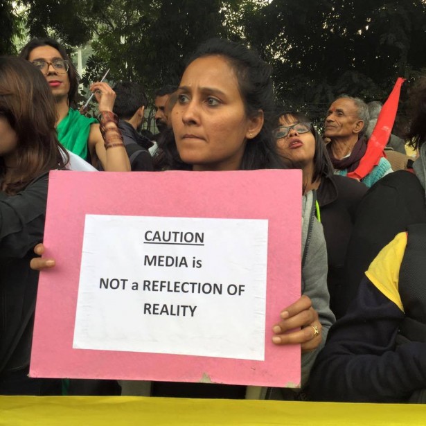 A woman holds a sign critical of the media at the march on Feb. 18. (Facebook/Stand With JNU)