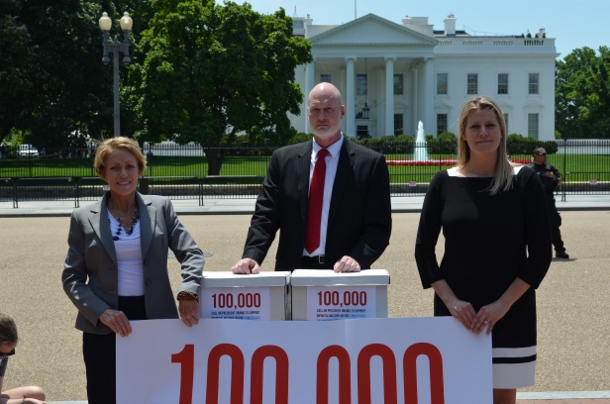 Don Christensen , with Samantha Jackson (right), a civilian victim of military sexual assault, and Navy whistleblower Paula Coughlin (left), attempt to deliver 100,000 petitions