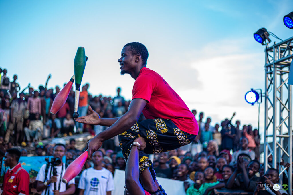 A juggling performance during the demonstration at Kituku Market