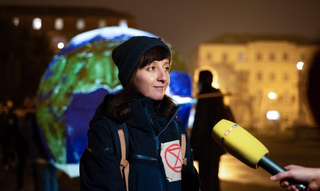 Lora, a rebel from XR Zagreb, is interviewed during a climate march