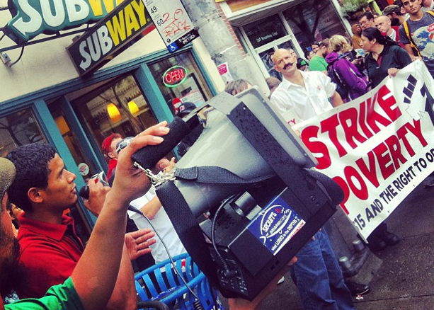 Striking Subway worker addresses march in Seattle. (WNV/Joshua Stephens)