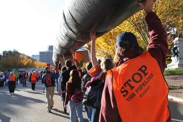 Keystone XL protesters carry a replica pipeline during a massive demonstration on November 6, 2011. (Flickr / Tar Sands Action / Christine Irvine)