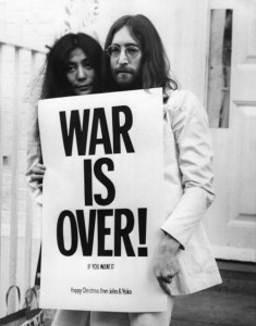 John Lennon and Yoko Ono pose on the steps of the Apple building in London, holding one of the posters that they distributed to the world's major cities as part of a peace campaign protesting against the Vietnam War. (Picassa/Frank Barratt)