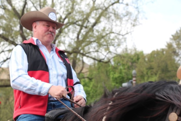Bob Allpress rides his horse on the National Mall at Reject and Protect. (WNV / Kristin Moe)