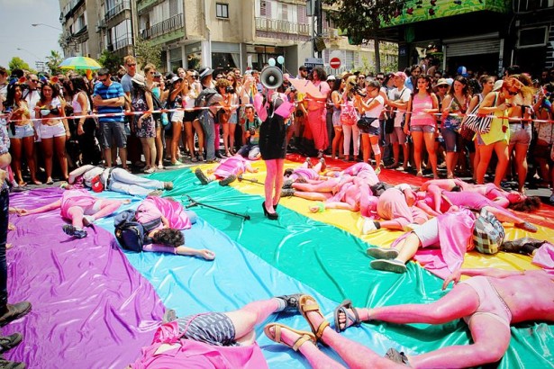 During the 2013 Tel Aviv Pride Parade, the anarcho-queer collective "Mashpritzot" held a die-in to protest Israeli pinkwashing, and the homonormative priorities of the city-sposored LGBT center. (Wikimedia Commons/TMagen)