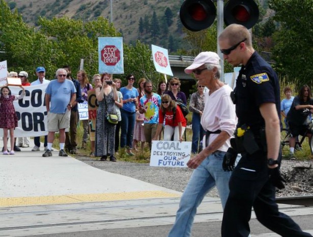 Four protesters delayed a coal train on its way through Missoula in a peaceful act of civil disobedience on August 16, while around 50 others cheered them on from the sidelines. (Blue Skies Campaign) 