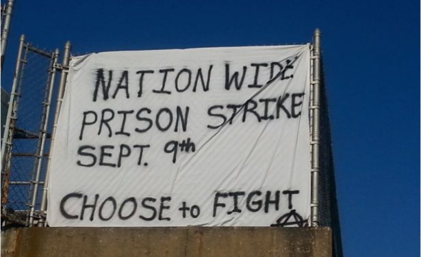 A banner drop in support of the upcoming nationwide prison strike appeared over the Lloyd Expressway in Evansville, Ohio last month. (Twitter / wheretheriverfrowns)