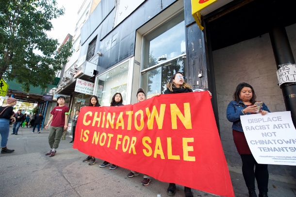 Residents and advocates protest gentrification of Chinatown outside the James Cohan Gallery. 
