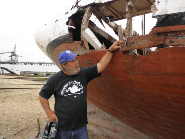 Fredy Champagne inspecting the damage to the Golden Rule in 2012.