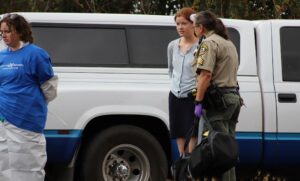 Cassie King cuffed and arrested at a factory farm
