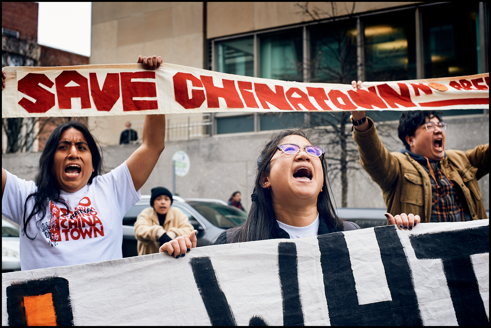 Members of Students for the Preservation of Chinatown protest