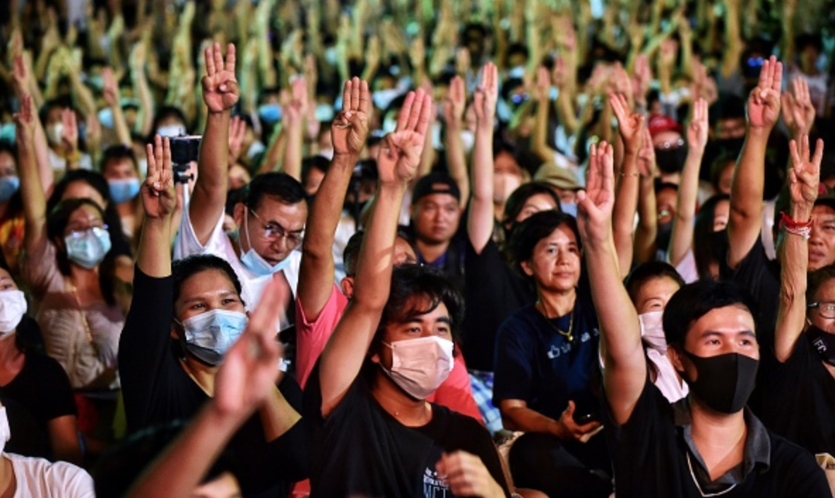 Thai pro-democracy protesters flash the Hunger Games salute.