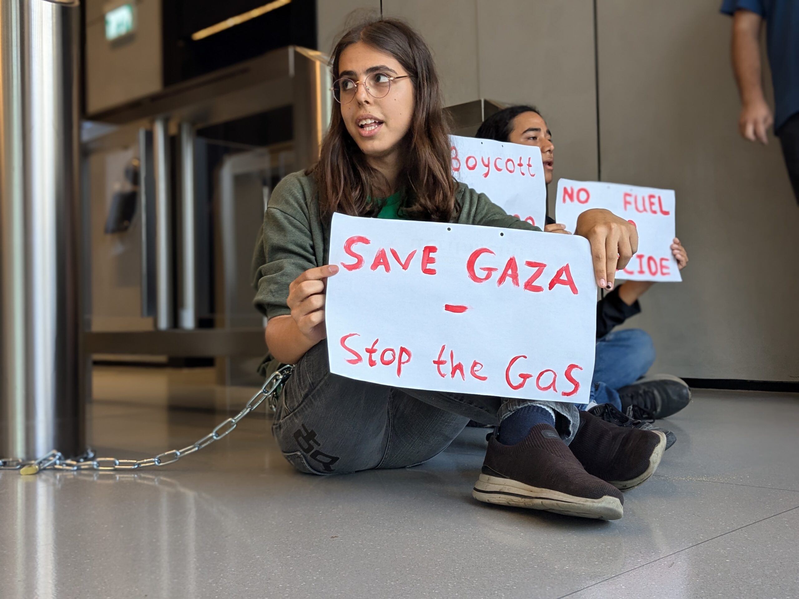 Israeli activists chained themselves up in the lobby of the Chevron corporate offices near Tel Aviv