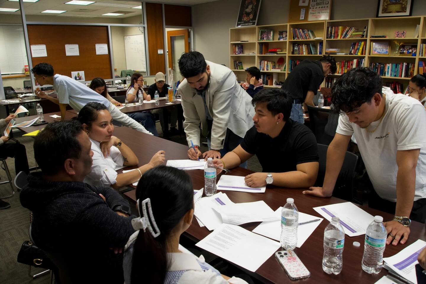 A group of young community members lead discussion on strategy for Asian refugee communities.