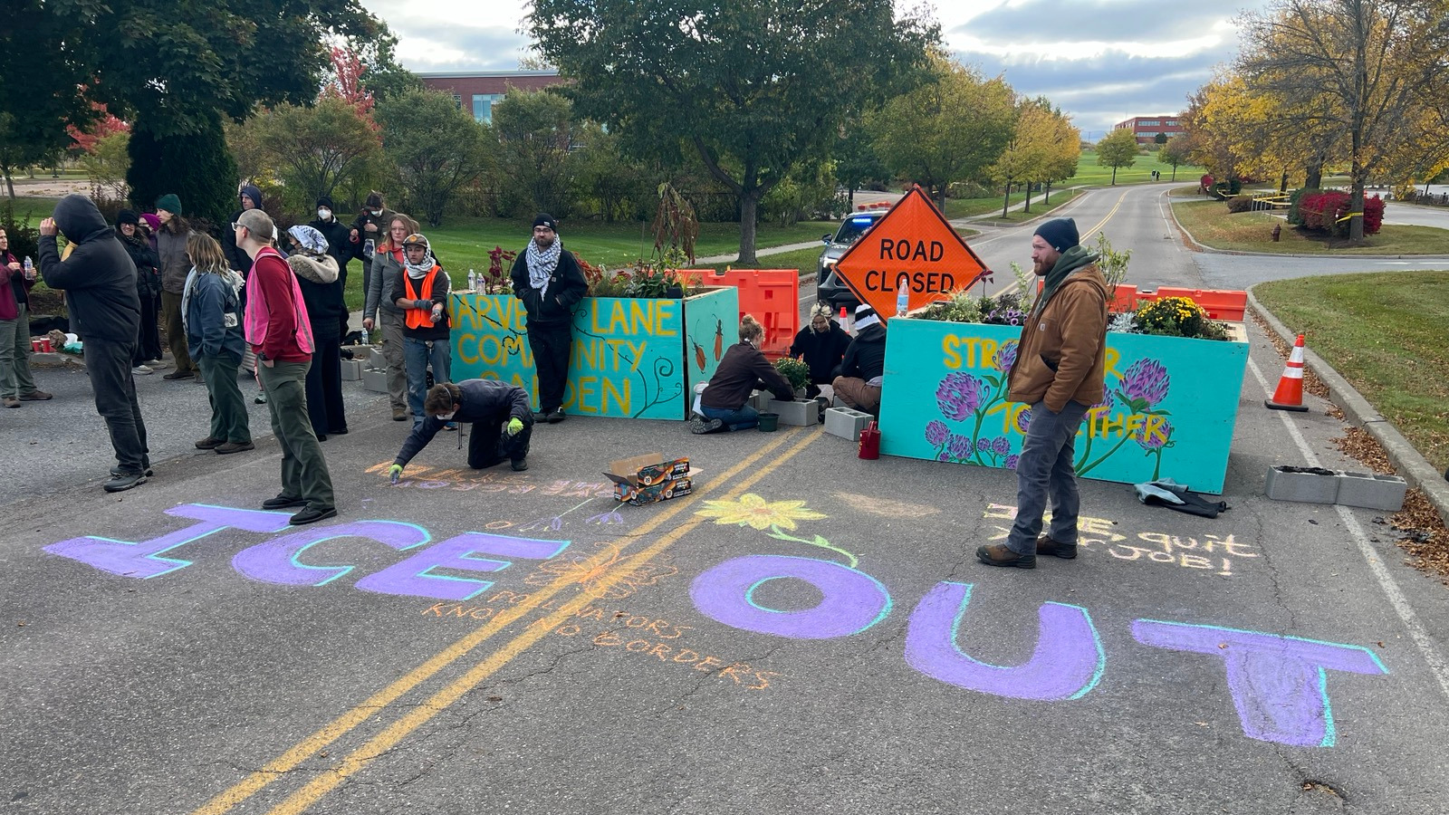 Protestors built a garden, blocking the road to an ICE facility housing the agency's national tip line in Williston, Vermont on October 6